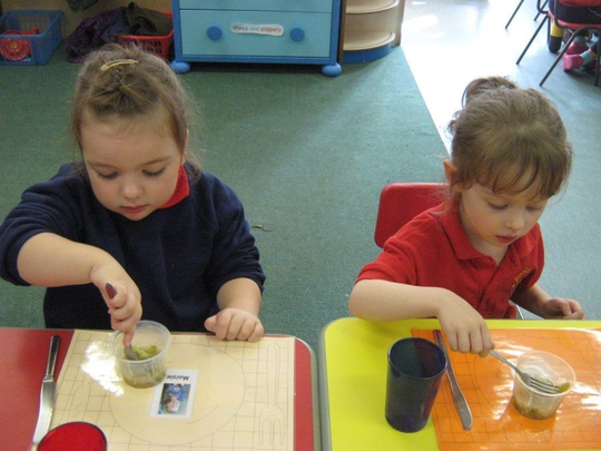 Rebecca enjoyed looking after her mummy when she came to school for lunch.