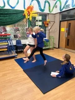 In gymnastics this week, the Year 6s created group sequences using unison and cannon - image 3 In gymnastics this week, the Year 6s created group sequences using unison and cannon - image 3