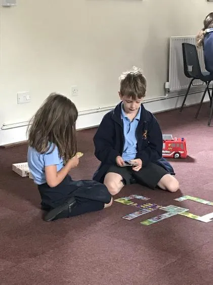 Enjoying some quiet games time after breakfast. - image 3