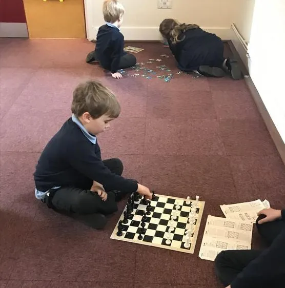 Enjoying some quiet games time after breakfast. - image 5