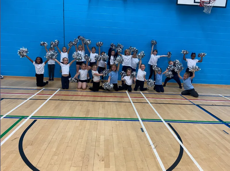 Key stage 1 children taking part in the Leeds Well School Partnership 'come and try' cheer event.