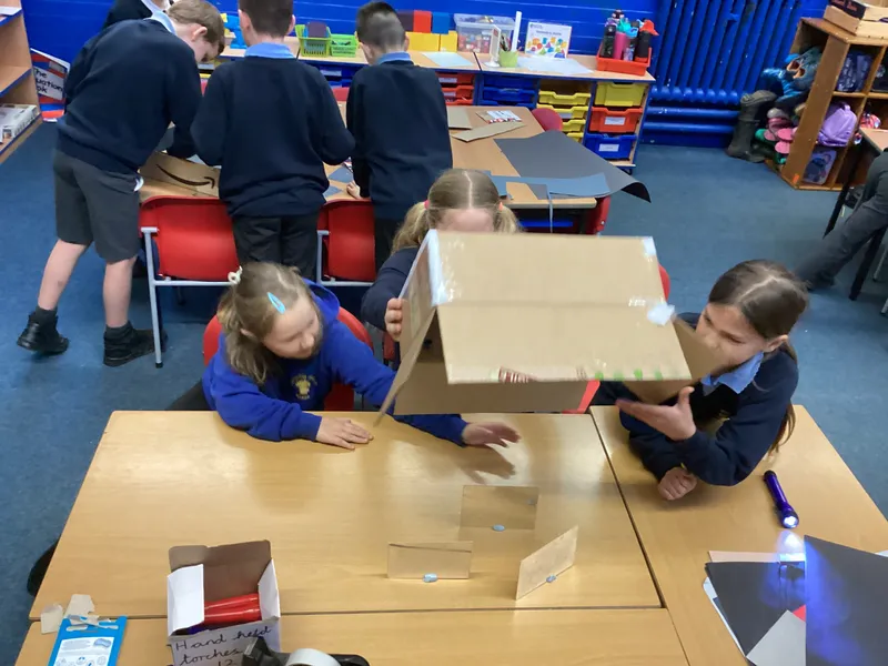Ospreys were challenged to make a torch light shine into a box and come back out of the same side in a different place using mirrors - image 3 Ospreys were challenged to make a torch light shine into a box and come back out of the same side in a different place using mirrors - image 3