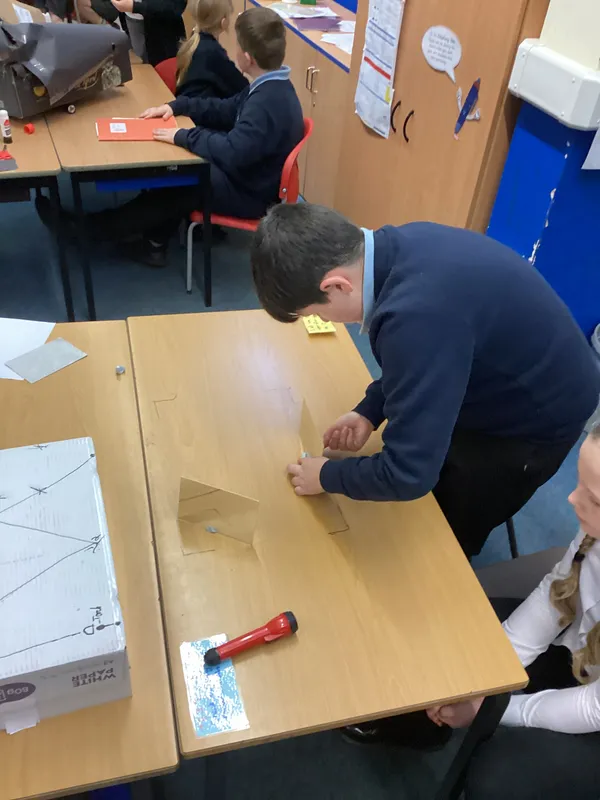 Ospreys were challenged to make a torch light shine into a box and come back out of the same side in a different place using mirrors - image 4 Ospreys were challenged to make a torch light shine into a box and come back out of the same side in a different place using mirrors - image 4