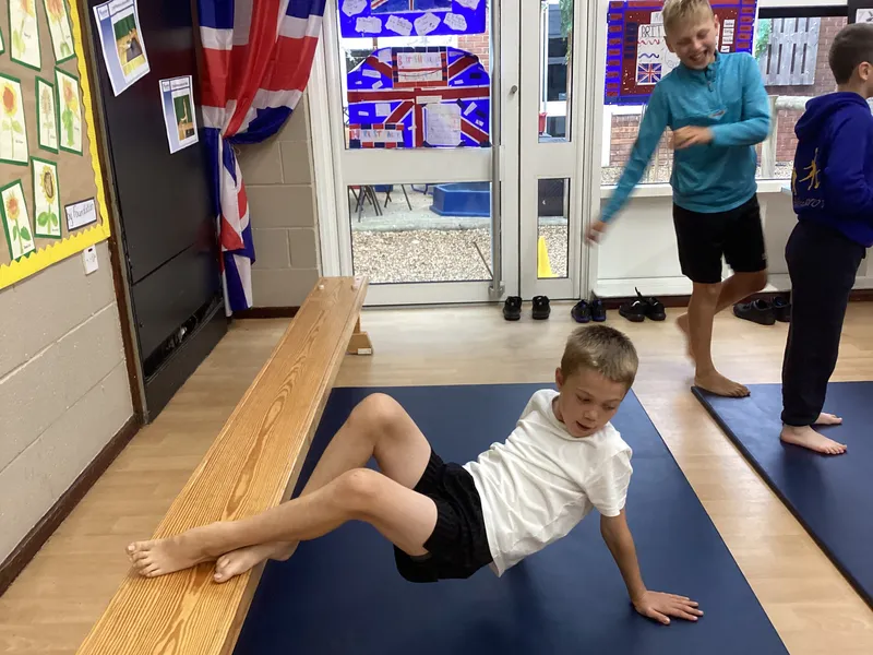 Gymnastics lesson exploring twisted shapes and balances with different points - image 1 Gymnastics lesson exploring twisted shapes and balances with different points - image 1
