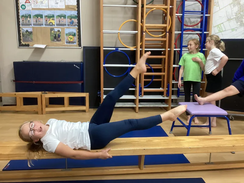 Gymnastics lesson exploring twisted shapes and balances with different points - image 8 Gymnastics lesson exploring twisted shapes and balances with different points - image 8