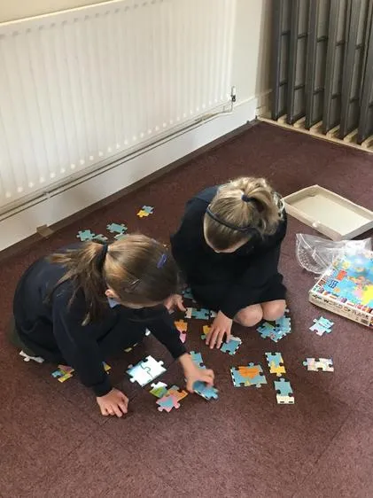Enjoying some quiet games time after breakfast. - image 1