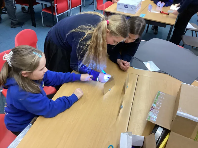 Ospreys were challenged to make a torch light shine into a box and come back out of the same side in a different place using mirrors - image 2 Ospreys were challenged to make a torch light shine into a box and come back out of the same side in a different place using mirrors - image 2
