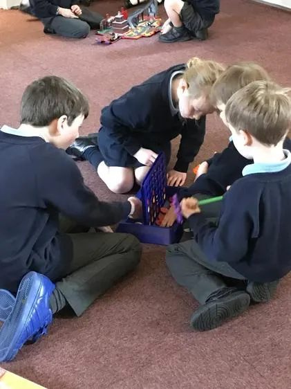Enjoying some quiet games time after breakfast. - image 2